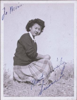 [Portrait of Sumie kneeling on grass, Heart Mountain, Wyoming, 1944]