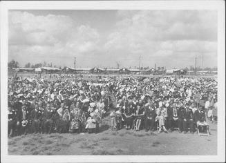 [Rows of people attending outdoor funeral in open field, Rohwer, Arkansas, September 30, 1944]