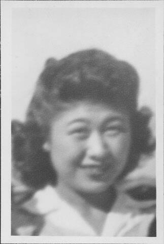 [Smiling young woman, head and shoulder portrait, Rohwer, Arkansas]