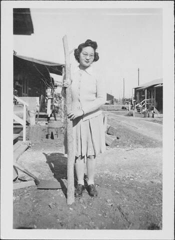 [Sakaye Nakatsuru and tree trunk, Rohwer, Arkansas, January 24, 1944/5?]