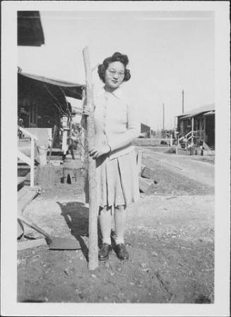 [Sakaye Nakatsuru and tree trunk, Rohwer, Arkansas, January 24, 1944/5?]