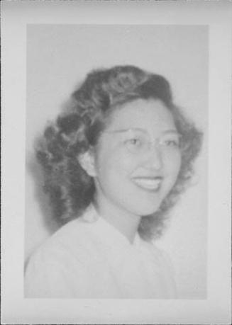 [Smiling woman wearing eyeglasses, head and shoulder portrait, Rohwer, Arkansas, October 29, 1944]