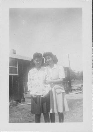 [Two young women standing side-by-side, Rohwer, Arkansas]