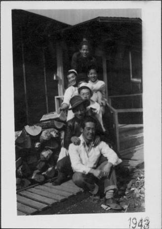 [Seven young men on barracks porch, Rohwer, Arkansas, 1943]