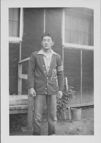 [Young man in letterman sweater, Rohwer, Arkansas]