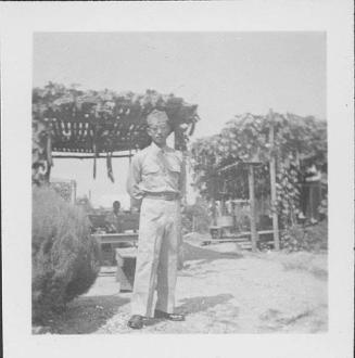 [Tetsu Ted Hasegawa in United States Army uniform standing in front of arbor, Rohwer, Arkansas, October 16, 1944]