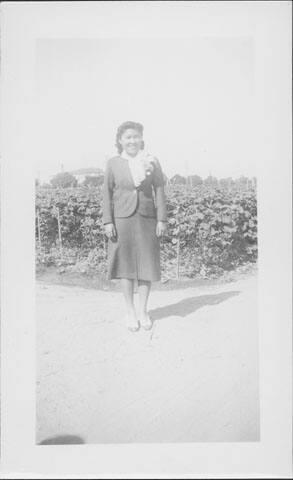 [Woman in suit with orchid corsage, United States, 1940]