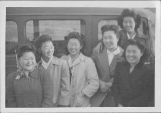 [Six young women in front of vehicle, Rohwer, Arkansas]