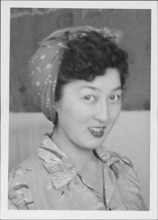 [Margaret Kikukichi with curly hair in headkerchief, head and shoulder portrait, Rohwer, Arkansas, November 3, 1944]