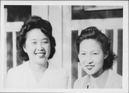 [Two women in front of barracks doors, Rohwer, Arkansas]