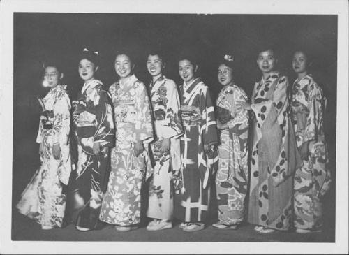 [Eight women in kimono standing in darkness, Rohwer, Arkansas]