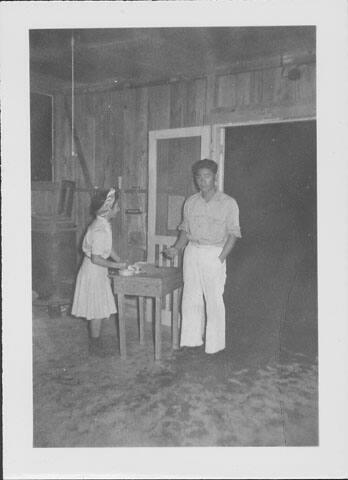 [Woman taking ticket from man at door, Rohwer, Arkansas]