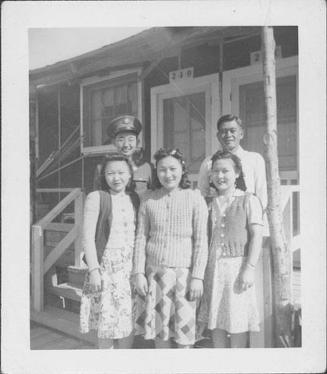 [United States Army soldier and four people in front of barracks unit, 2-3-D, Rohwer, Arkansas]