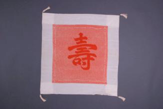 [Red kotobuki fukusa with white border and tassels]