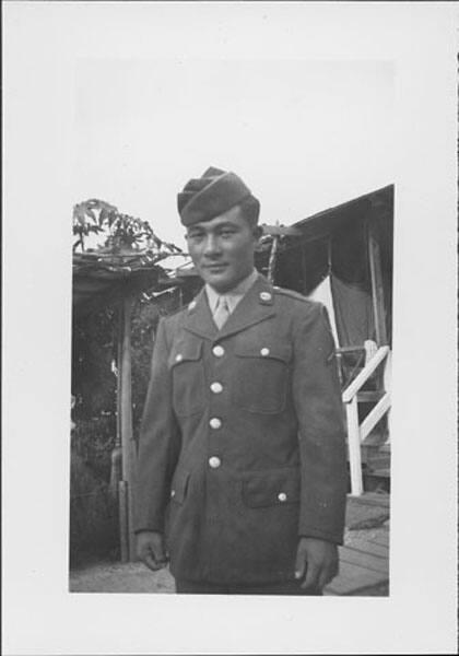 [United States Army soldier in front of barracks, three-quarter portrait, Rohwer, Arkansas, March 1945]