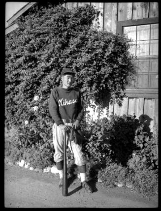 Young man in "Mikasa" baseball uniform