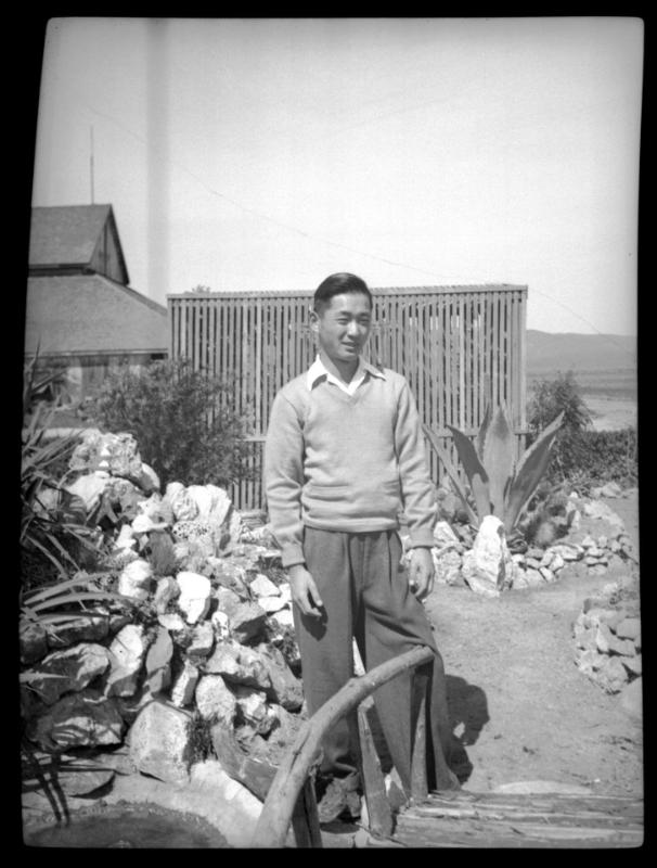 Frank Miwa standing in a garden