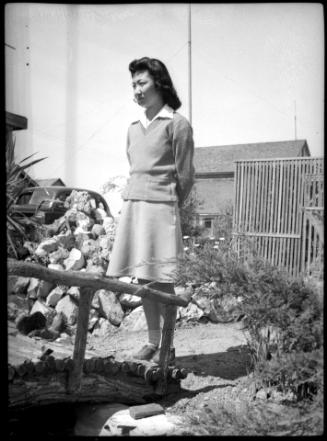 Mae Miwa standing in a garden