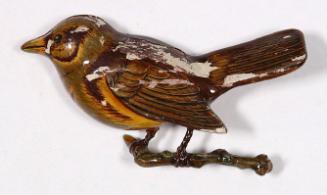 Carved brown sparrow bird pin