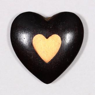 Carved wood heart with inner yellow heart
