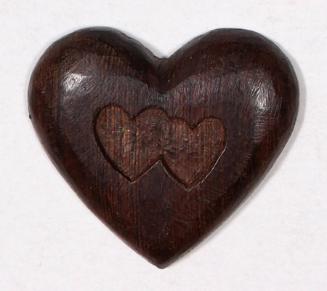 Carved wood heart with two carved hearts