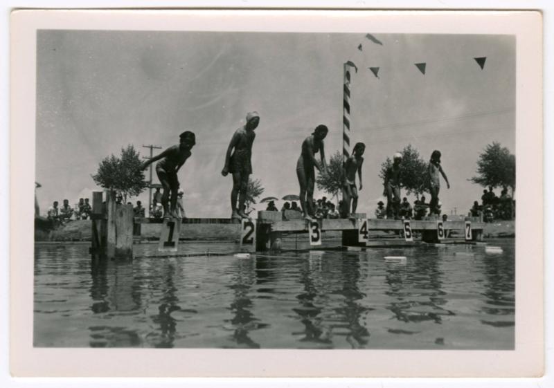 Six girls ready to dive into the water