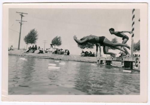 Six men diving into the water