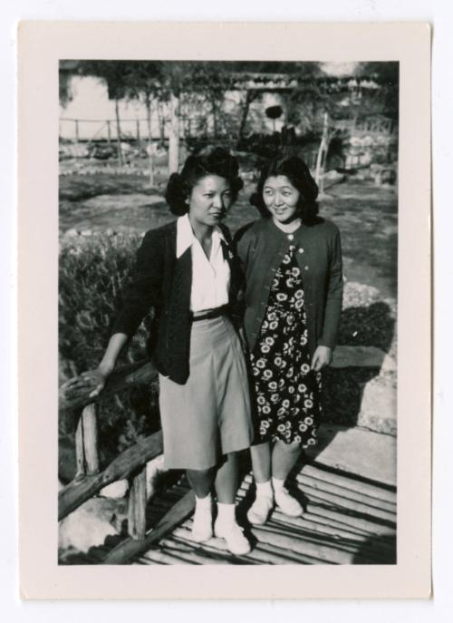 Two women on footbridge