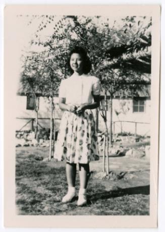 Woman in floral-print skirt