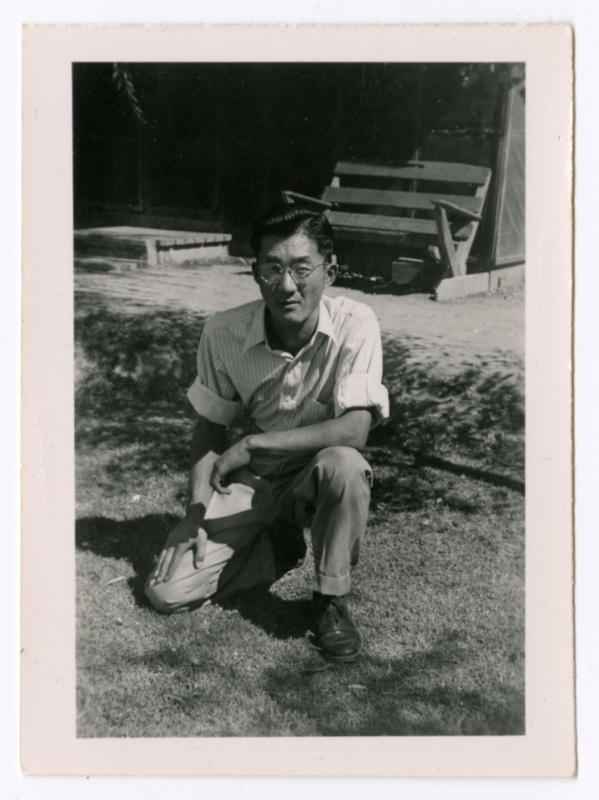 Man kneeling in yard