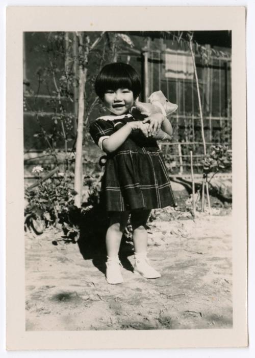 Young girl with dog toy