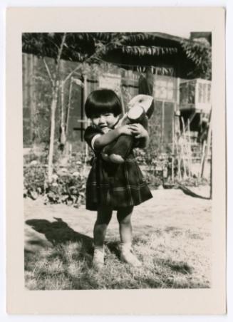 Young girl with rabbit toy