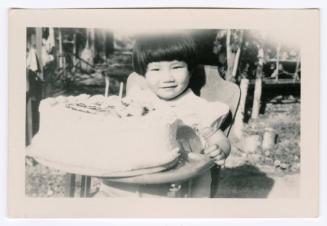 Young girl with birthday cake