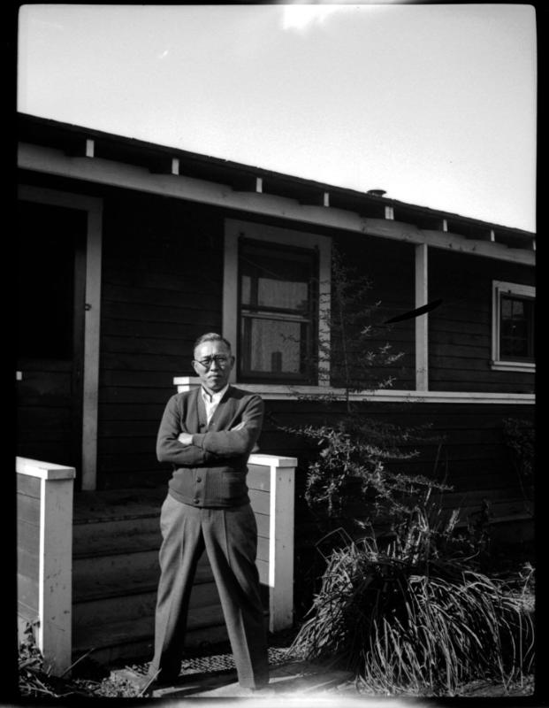 Man in front of house