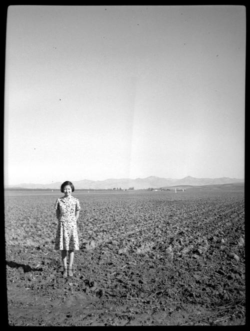 Young woman in empty field