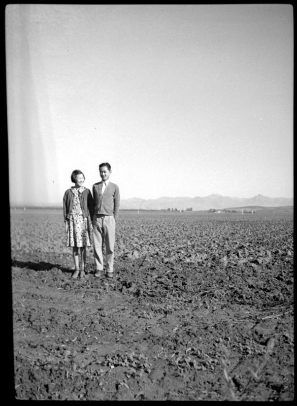 Young man and woman in an empty field