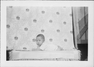 [Infant on lying on stomach, facing left, Rohwer, Arkansas, September 23, 1944]