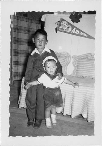 [Toddler in sailor outfit and boy in suit, Rohwer Arkansas, May 24, 1944]