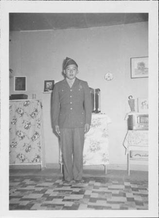 [Soldier in dress uniform in barracks, Rohwer, Arkansas, 1942-1945]