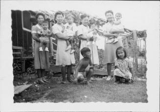[Women and children outside of barracks, Rohwer, Arkansas]