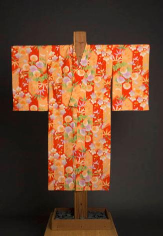 [Girl's red and peach silk kimono with plum blossom, chrysanthemum and bamboo design, Waipahu, Hawaii, ca. 1930]