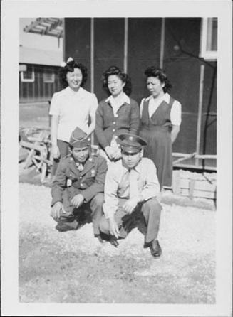 [Two soldiers and three women, Rohwer, Arkansas, February 11, 1945]