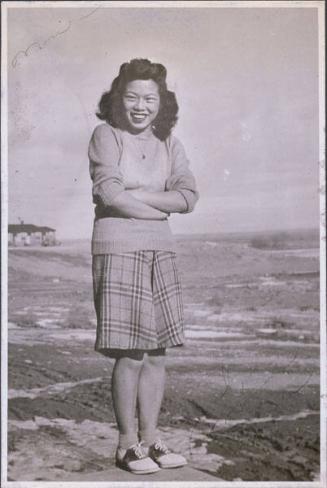 [Portrait of Marion Nida standing with arms crossed, Heart Mountain, Wyoming, 1944]
