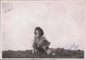 [Portrait of Fumi Munekiyo sitting on ground, Heart Mountain, Wyoming, May 27 1944]