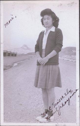 [Portrait of Kim Yakayama, with Heart Mountain in background, Wyoming, 1944]