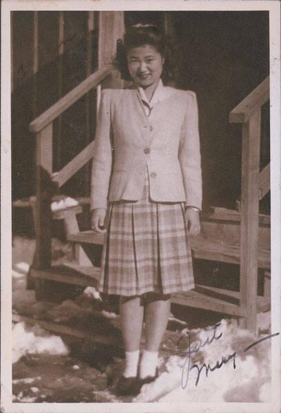 [Portrait of Mary in front of barracks steps, Heart Mountain, Wyoming, Winter 1944-1945]