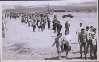 [Heart Mountain evacuees heading back to camp after sending off friends, Heart Mountain, Wyoming, May 1945]