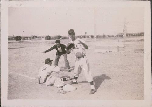 [Tas Yamada sliding into first base, Heart Mountain, Wyoming, May 1944]