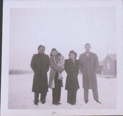 [Two couples and a child standing in snow, Heart Mountain, Wyoming, Winter 1944-1945]