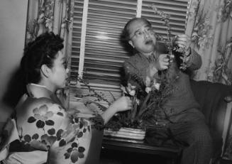 [Teshigawara and Mrs. Ishikawa arranging flowers at Miyako Hotel, Los Angeles, California, March 17, 1951]